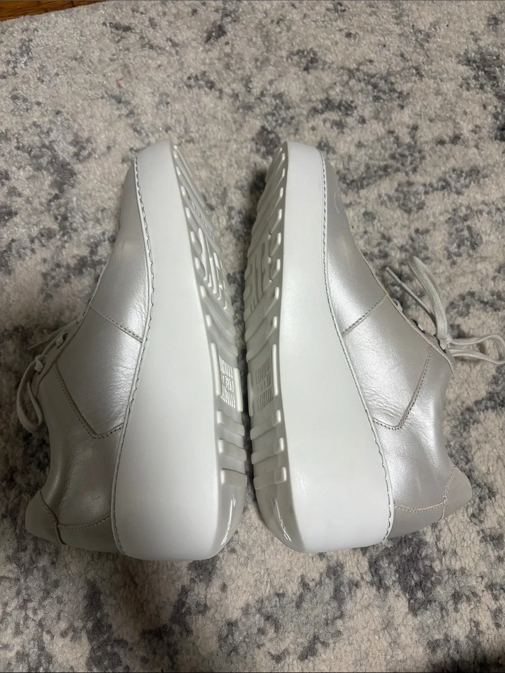 Fly London Dipo wedge trainers in silver leather with a thick white wedge sole